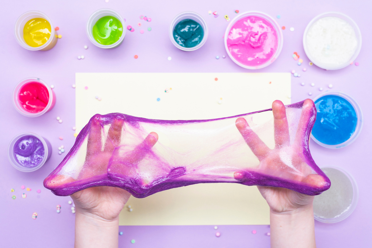 Person Playing with Colorful Slimes 